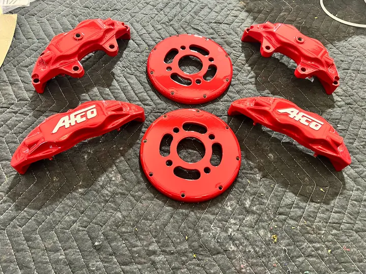 Red calipers and brackets with AFCO lettering