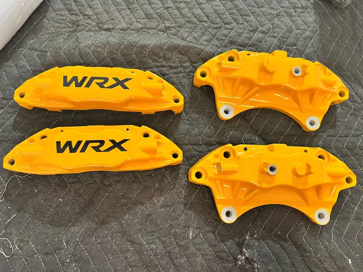 Yellow WRX calipers with black lettering