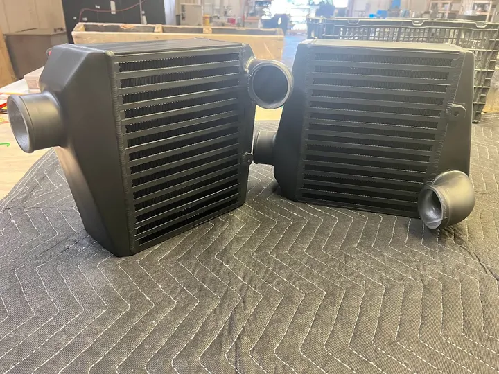 Two black coated intercoolers