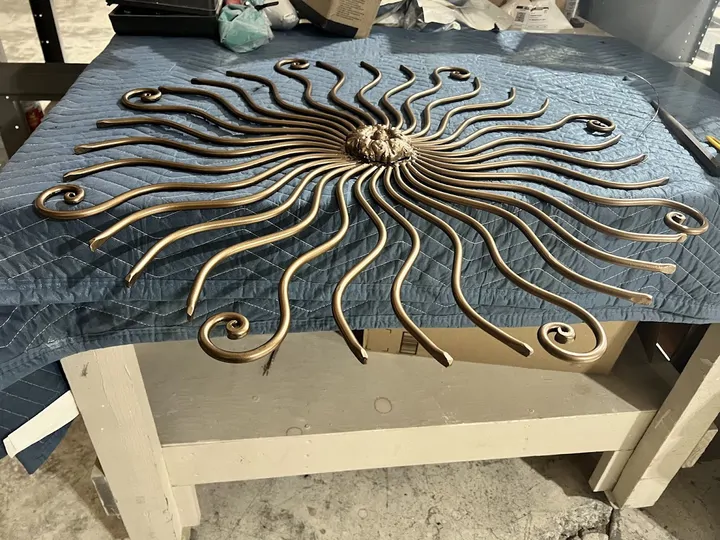 Bronze sunburst metal wall art