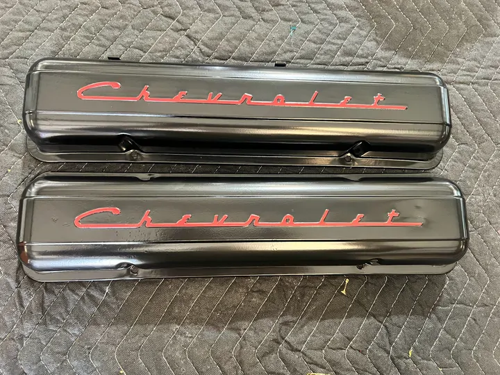 Black Chevrolet valve covers with red script