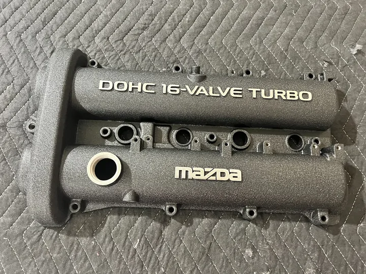Textured gray Mazda DOHC 16-valve turbo cover