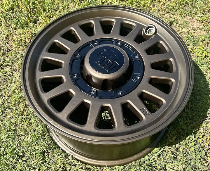 Bronze off-road wheel with a black center