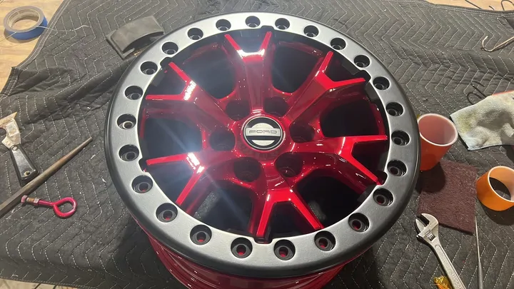 Red beadlock wheel with a silver ring