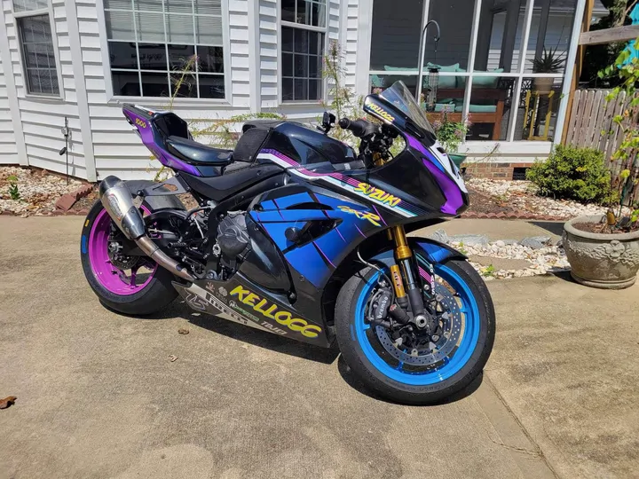 Sport bike with purple and blue coated wheels